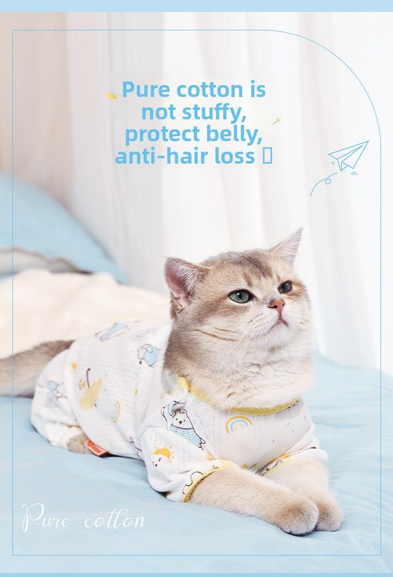 Ragdoll kitten wearing summer cat clothing with anti-shedding, breathable full-cover suit on a bed.
