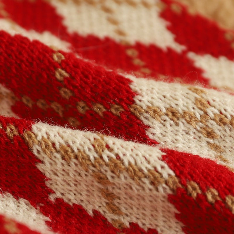 Warm knitted pattern of New Year cat clothing in red and beige.