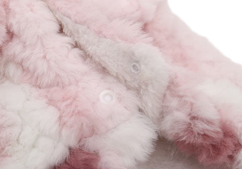 Fluffy pink and white cat winter coat with snap buttons for warmth.