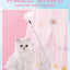Cat teaser wand toy with feathers and bells in a glass vase, next to a fluffy white cat against a pink background.