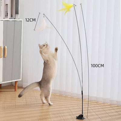 Cat playing with steel wire teaser feather toy on long pole with suction cup for self-amusement.