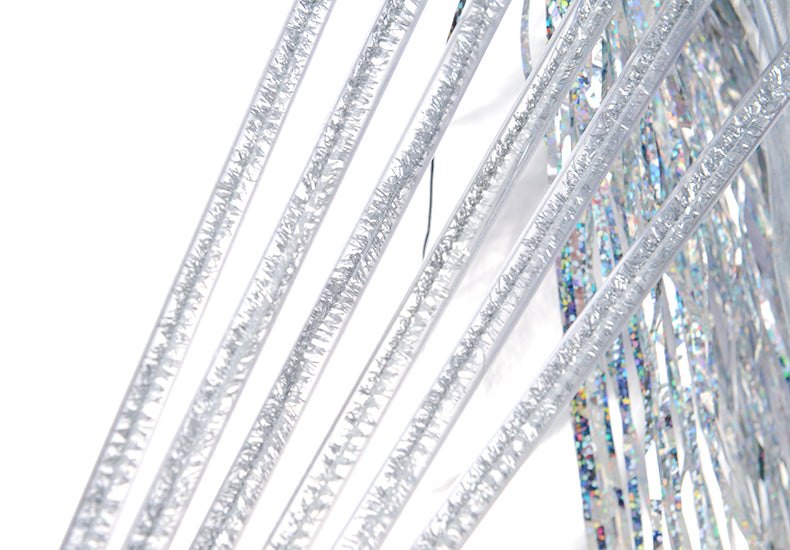 Close-up of a cat teaser wand with sparkling strips for pet play.